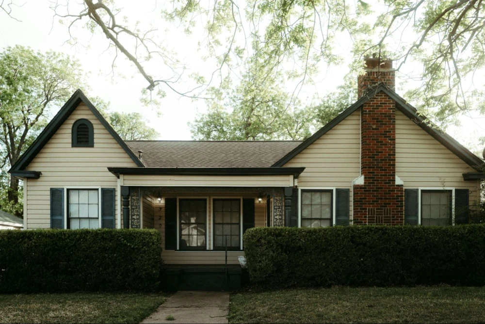 Updated home exterior with new siding, roof, windows & improved curb appeal